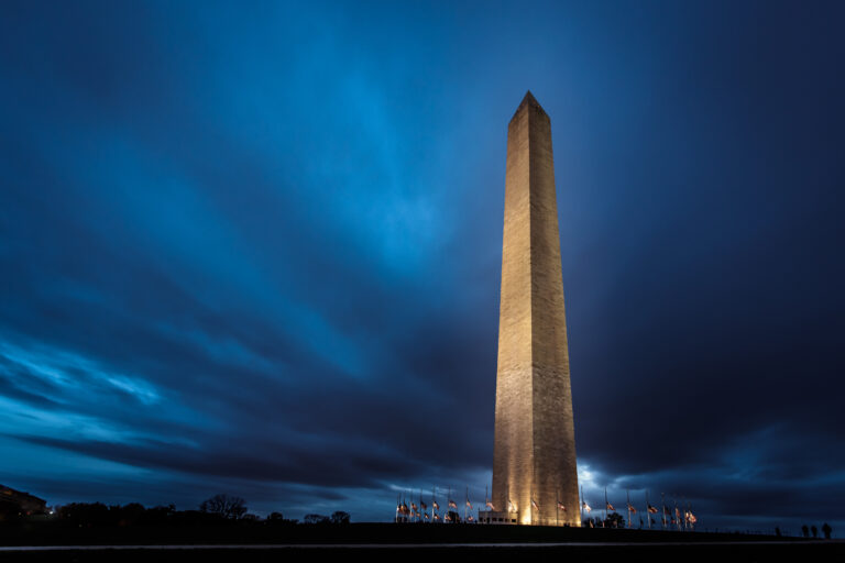 Photo of the Washington Monument at night.